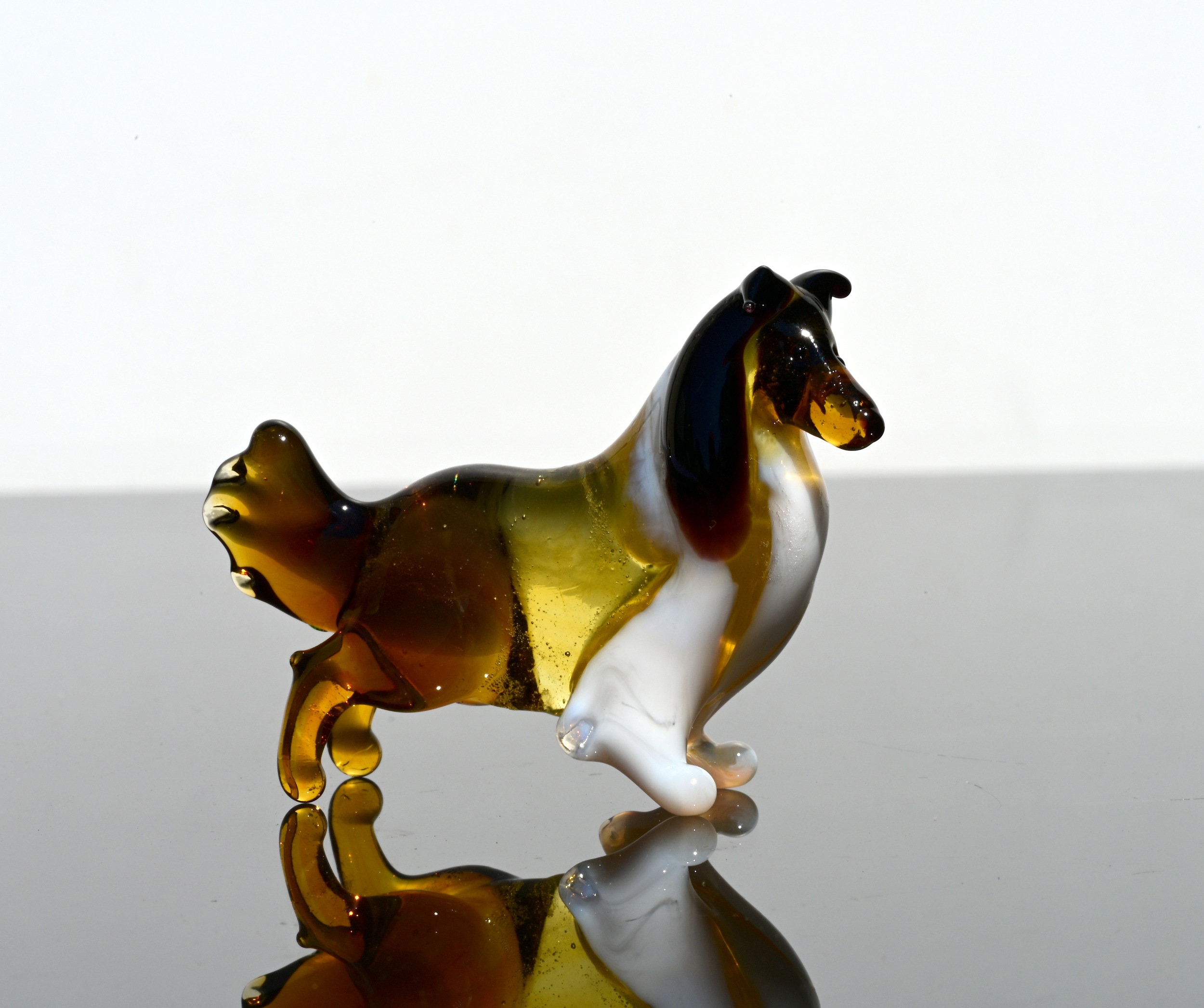 Realistic looking Glass Collie. Lots of personality and intricate details. Excellent addition to your collection.