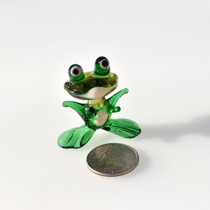 Cute green glass  frog. Whimsical figurine with a lot of character and personality. Excellent addition to your glass collection, unique gift