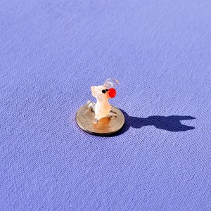 Cute tiny glass pig. Whimsical figurine with a lot of character and personality. Excellent addition to your glass collection, unique gift.