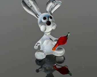 Cute white-clear glass  bunny with carrot. Whimsical figurine; lots of character. Excellent addition to your collection, unique gift.