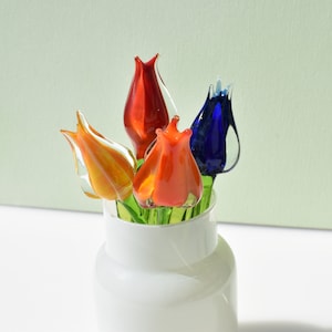 Gorgeous  bouquet of 4 colorful glass tulips.  Excellent addition to your home décor.
