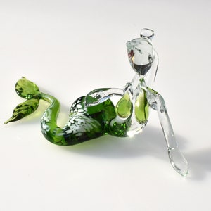 Clear Green Glass Mermaid, Detailed figurine with a lot of personality. Excellent addition to your glass menagerie collection.