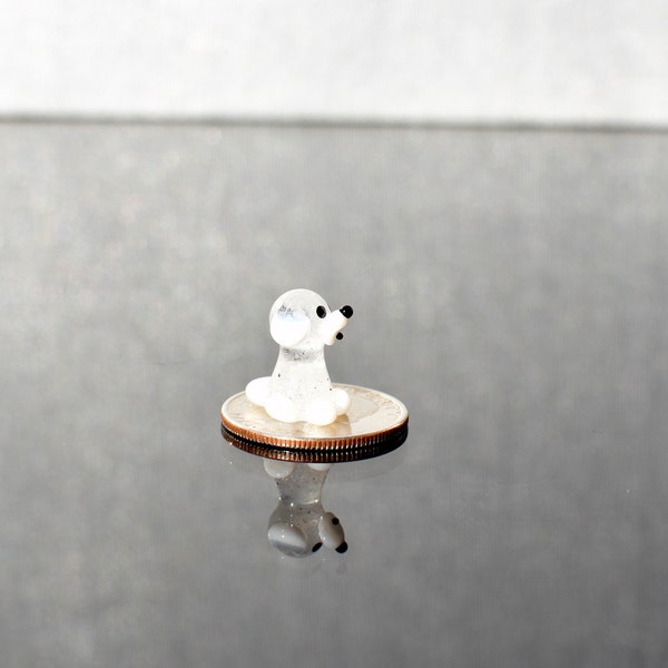 Cute Tiny clear-white glass puppy dog. Whimsical figurine with a lot of character and personality. Excellent addition to your collection.