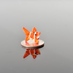 Cute glass orange-red  fish. Whimsical figurine with a lot of character and personality. Excellent addition to your glass collection.