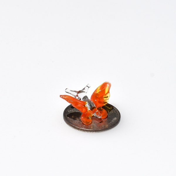Cute tiny glass orange Butterfly. Whimsical figurine with a lot of character and personality.