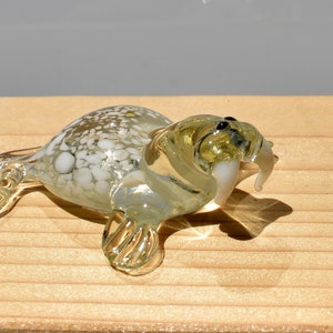 Elegant clear glass walrus. Whimsical figurine with a lot of character and personality. Excellent addition to glass menagerie collection.