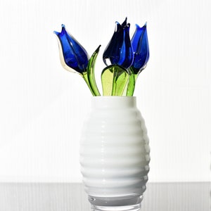Blue-clear glass  beautiful tulip.  Excellent addition to your glass collection, unique gift. Each flower is priced individually.