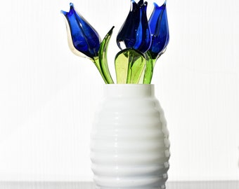 Blue-clear glass  beautiful tulip.  Excellent addition to your glass collection, unique gift. Each flower is priced individually.