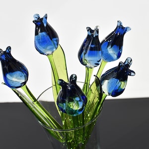 Long stem Beautiful Blue-clear glass tulip.  Excellent addition to your glass collection, unique gift. Each flower is priced individually.