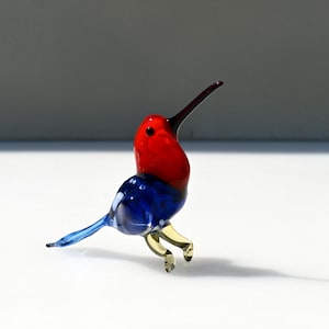 Beautiful Glass colorful hummingbird. Blue-orange figurine with a lot of intricate details. Excellent addition to your collection.