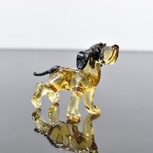 Realistically looking glass dog. Whimsical figurine; lot of character and personality. Excellent addition to your glass collection.