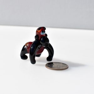 Cute glass gorilla. Whimsical figurine with a lot of character and personality. Excellent addition to your glass collection, unique gift.