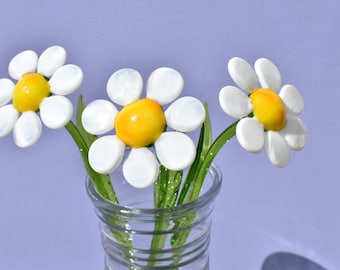 Beautiful long stem white-yellow  glass daisy flower. Excellent addition to your glass collection. Each flower is priced individually.