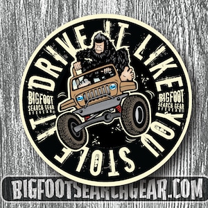 May include: A black and white circular sticker with the text "Drive It Like You Stole It" in a circular design. A cartoon image of a Bigfoot driving a jeep is in the center of the sticker. The text "Bigfoot Search Gear" is at the top and bottom of the sticker.