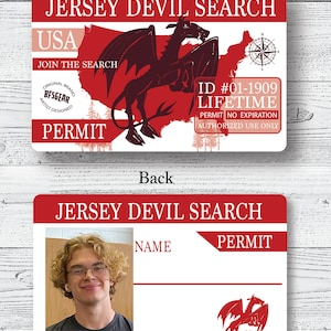 May include: A red and white card with the text "Jersey Devil Search" and a red and black illustration of a mythical creature. The card also includes the text "USA", "Join the Search", "Original Brand", "BFSGEAR", "Artist Designed", "Permit", "ID #01-1909", "Lifetime", "Permit No Expiration", "Authorized Use Only". The back of the card has a photo of a person with the text "Join the Search", "Name", "Permit", and a red and black illustration of a mythical creature.