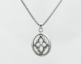 Sterling silver oval shaped stylized Flower pendant on 18" round box chain.