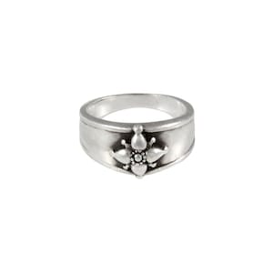 Sterling silver ring with True North four point star compass motif on tapered band.