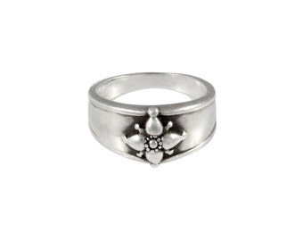 Sterling silver ring with True North four point star compass motif on tapered band.