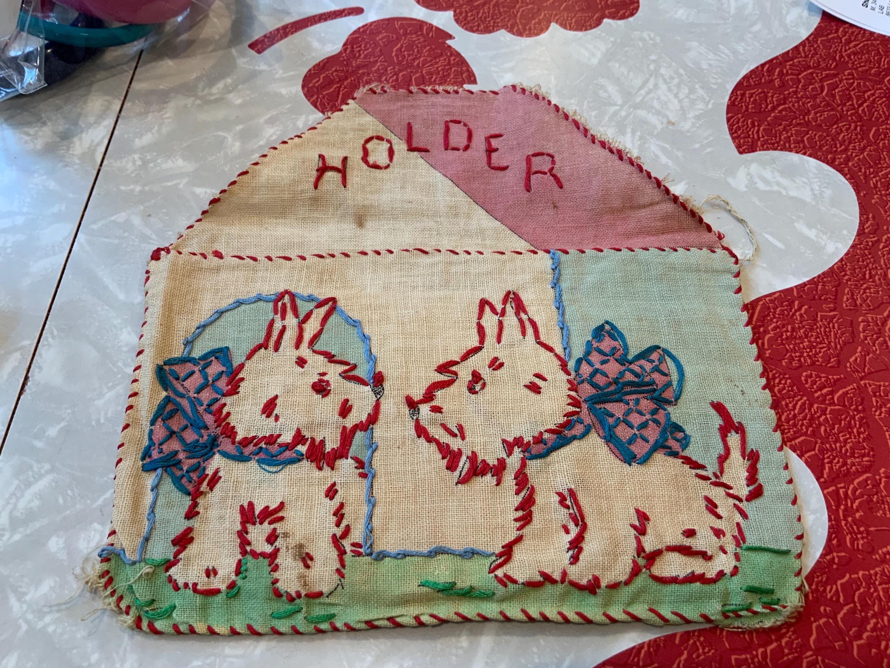 Primitive 1920’s-1930’s hand embroidered burlap holder featuring Scottie Dogs
