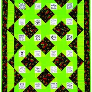 May include: A rectangular quilt featuring a vibrant lime green and black fabric pattern with a strawberry motif. The design includes alternating solid lime green squares and black squares with strawberries, interspersed with white fabric patches containing black text.