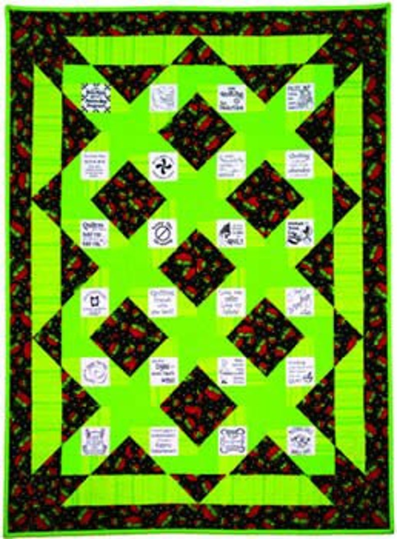 May include: A rectangular quilt featuring a vibrant lime green and black fabric pattern with a strawberry motif. The design includes alternating solid lime green squares and black squares with strawberries, interspersed with white fabric patches containing black text.