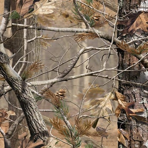 May include: A camouflage pattern featuring brown, tan, and gray colors. The pattern includes branches, leaves, and pine needles.