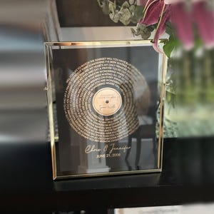 Personalized Print with Song Lyrics in the shape of a Vinyl Record created using Gold Foil, Rose Gold Foil, Silver Foil or any other color foil options we carry on Black Paper. First Dance, Wedding Song, Couples Gift, First Wedding Anniversary gift.