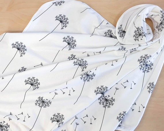 White dandelion organic cotton knit newborn blanket.