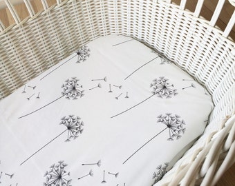 White dandelion fitted bassinet sheet.