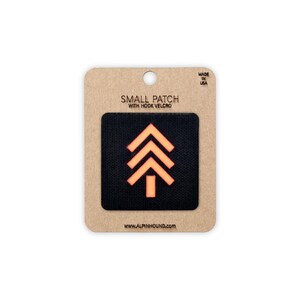 Petit écusson tactique noir et orange réfléchissant