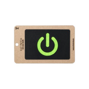 May include: A rectangular black hat patch with a bright neon green power button symbol in the center. The patch is mounted on a tan cardboard backing card that features the text HAT PATCH WITH HOOK VELCRO, MADE IN USA, and ALPHAHOUND.COM.