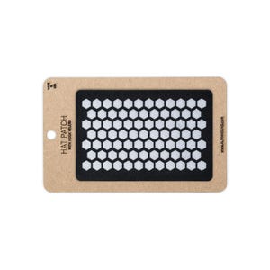 May include: A rectangular black hat patch featuring a white honeycomb pattern. The patch is mounted on a tan cardboard backing with the text HAT PATCH WITH HOOK VELCRO, MADE IN USA, and WWW.ALPHAHOUND.COM printed in black ink.