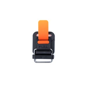 May include: A black plastic buckle with an orange pull tab. The buckle has a metal loop and the text "PULL" is printed on the front.