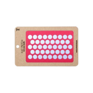 May include: A rectangular pink hat patch with a grid of white circular hook-and-loop fasteners. The patch is mounted on a tan cardboard backing with the text HAT PATCH WITH HOOK VELCRO and MADE IN USA printed on the left side and ALPHAHOUND.COM on the right.