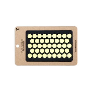 May include: A rectangular tan cardboard backing card featuring a black hook-and-loop patch with a grid of pale yellow circles. The text reads HAT PATCH WITH HOOK VELCRO, MADE IN USA, and WWW.ALPHNHOUND.COM. The patch is centered on the card.