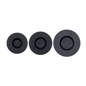 May include: Three black circular stovetop burner covers of different sizes.