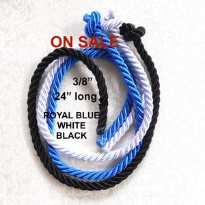 May include: Three twisted ropes in royal blue, white, and black, each knotted at the top. The ropes measure 3/8 inch in diameter and 24 inches in length. The text ON SALE, 3/8", 24" long, ROYAL BLUE, WHITE, and BLACK is printed on the image.