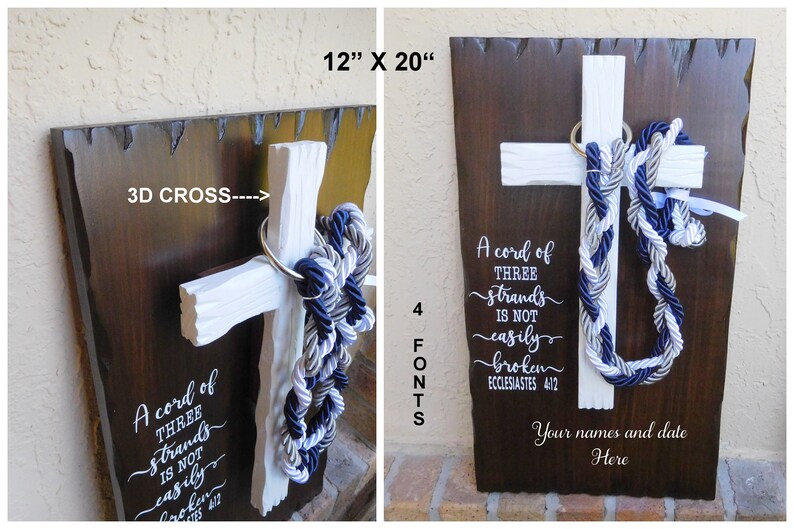 May include: A 12" x 20" dark brown wooden plaque featuring a white 3D cross with a braided navy, grey, and white rope. The text reads: A cord of THREE strands is NOT easily broken ECCLESIASTES 4:12 and Your names and date Here.