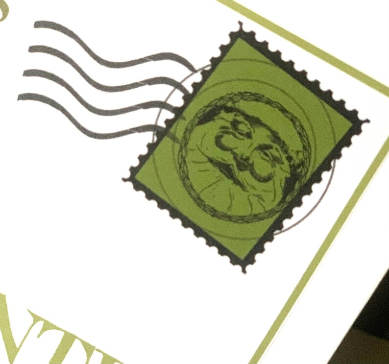 May include: A close-up of a green postage stamp with a black border and a circular design. The stamp features a detailed illustration within a circle. Black curved lines suggest movement, and the background is white.