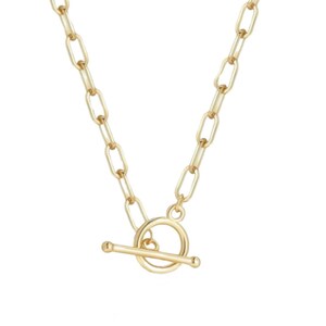 May include: A gold-toned necklace featuring a series of elongated oval links connected to a circular toggle clasp with a horizontal bar. The chain has a polished metallic finish and a consistent link design throughout the entire length of the piece.