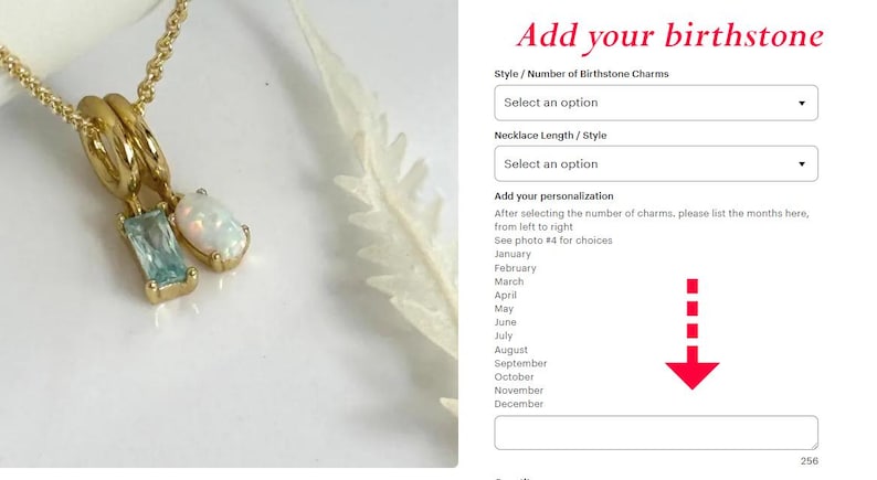 May include: A gold-colored necklace with two gemstone pendants: a rectangular aquamarine and an oval opal. The necklace is displayed on a white surface, with a feather-like object in the background. The text "Add your birthstone" is visible.