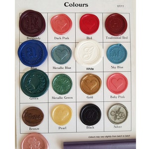 May include: A chart showing different colors of wax seal stamps. The colors include burgundy, dark pink, red, traditional red, blue, metallic blue, white, sky blue, green, metallic green, gold, baby pink, bronze, pearl, black, silver, metallic blush pink, and metallic lilac.
