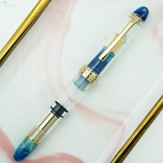 LORELEI 667 透明ピストン万年筆、ブルーグリーンアクリル、イリジウム