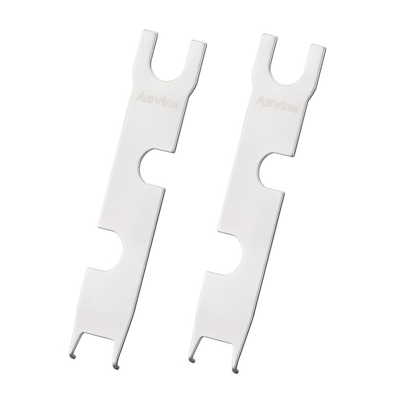 May include: Two silver metal tools with a U-shaped opening at the top and multiple cutouts along the length. The tools are labeled "Asvine".