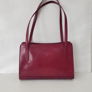 Monsac Genuine Leather Satchel Shoulder Handbag Magenta Silver Accents Top Zipper Double Handle Flap Pocket Logo Lining Zip & Pouch Pockets