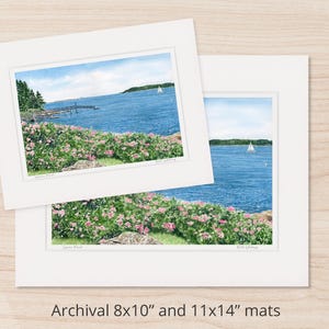 Archival matted watercolor art print of Spruce Point in Boothbay Harbor with blooming roses along the shoreline and calm blue ocean beyond.