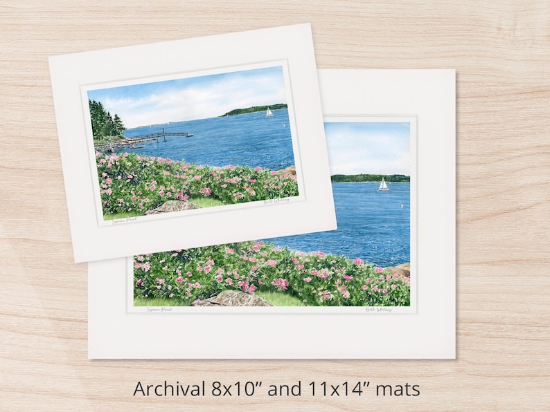 Archival matted watercolor art print of Spruce Point in Boothbay Harbor with blooming roses along the shoreline and calm blue ocean beyond.