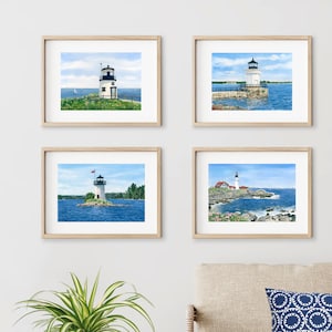 Maine lighthouse prints in a gallery wall arrangement.