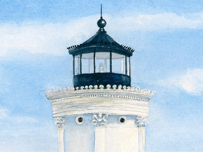 Close-up detail of Bug Light showcasing the lighthouse lantern room against a soft blue coastal sky.