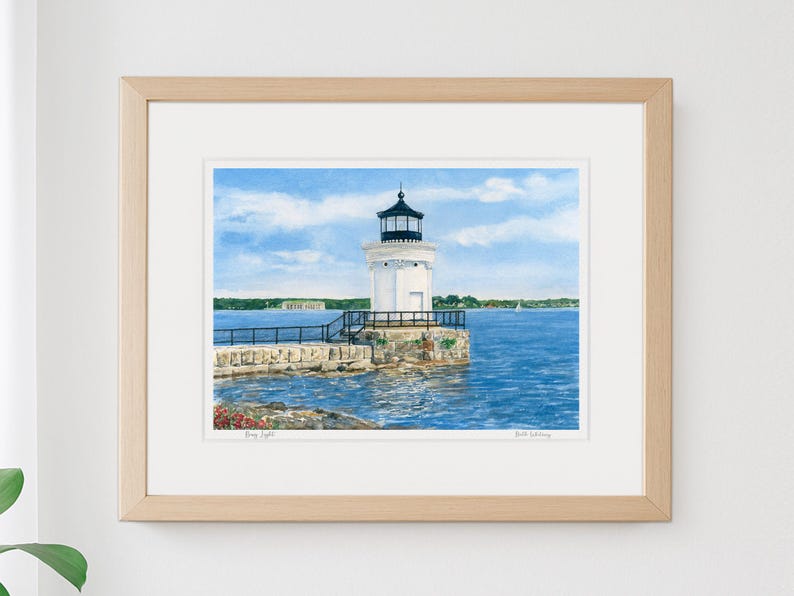 Framed watercolor art print of Bug Light in South Portland, featuring the white lighthouse standing on the stone breakwater in Portland Harbor.